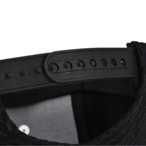 Detail of adjustable snapback closure and breathable honeycomb mesh on black hip hop cap