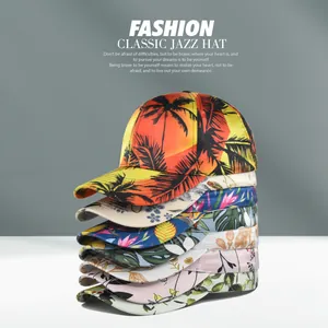 Stack of floral and tropical print baseball caps showcasing diverse patterns and satin fabric