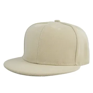 Detail view of a beige flat brim snapback hat showing twill fabric and six-panel structure