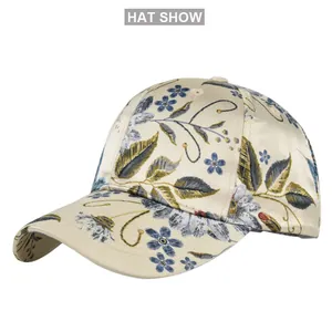 Detail of floral printed baseball cap with satin texture and elegant flower embroidery