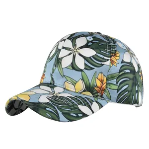 Detailed macro view of tropical floral embroidery on light blue baseball cap