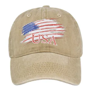 Detail of vintage washed khaki baseball cap featuring USA flag print and embroidery