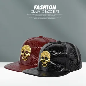 Detail of hip hop faux crocodile leather baseball hats with golden skull emblem