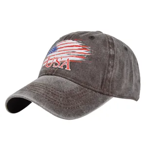 Detail of USA embroidery and flag print on washed dark grey cotton mesh baseball cap