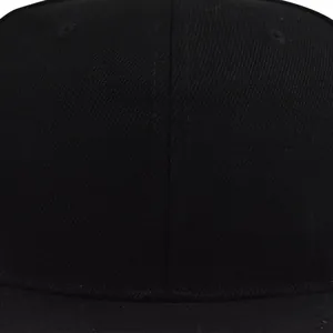 Detailed close-up of stitching on a black cotton twill flat-brim baseball cap
