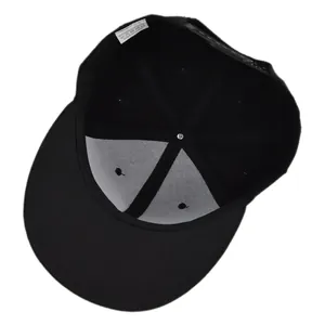 Detail view of the black snapback cap showing the 80% acrylic 20% wool fabric label inside