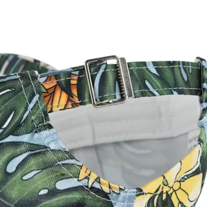Detail of tropical floral baseball cap showing metal buckle and 100% polyester label