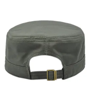 Detail of adjustable back strap and vintage bronze metal buckle on the canvas cadet cap