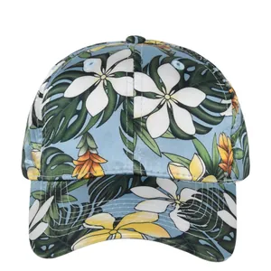 Tropical floral baseball cap with plumeria print and green leaves on light blue fabric