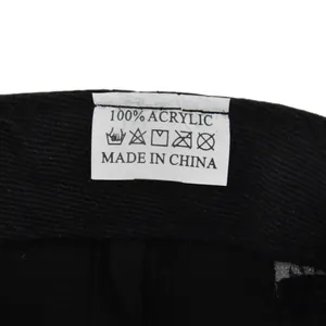 Close-up of the care label showing 100% Acrylic material and washing instructions