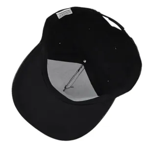 Detail view of the black hip hop cap interior showing 100% acrylic tag and reinforced lining