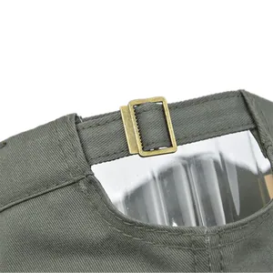 Detail of army green military cap featuring a metal buckle and adjustable cotton strap
