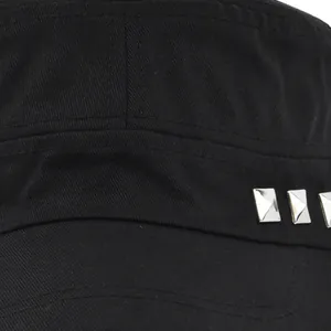 Close-up of black cotton canvas military hat featuring silver metal square rivets
