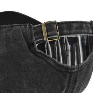 Detail of washed black denim baseball cap with vintage bronze metal adjustable buckle