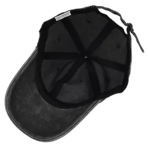 Detail view of cotton baseball cap interior with 100% cotton label and adjustable strap