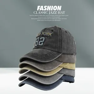 Close-up of stacked vintage washed baseball caps with New York 92 embroidery detail