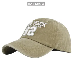 Close-up of NEW YORK 92 3D embroidery and washed cotton texture on khaki baseball cap