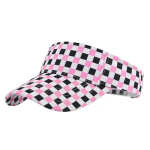 Side view of pink and black checkerboard visor hat with durable canvas texture for sun protection