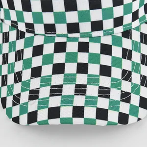 Detailed macro view of checkerboard pattern fabric and stitching on visor cap