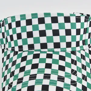Detail of checkerboard sun visor hat showing precise stitching and woven canvas texture