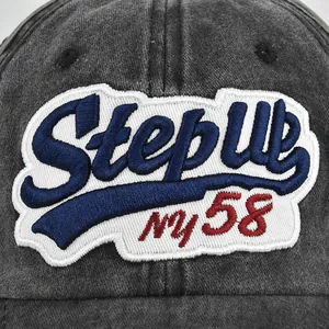 Vue de face d'une casquette de baseball vintage en toile délavée avec broderie Step Up