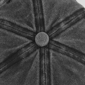Macro shot of charcoal grey washed cotton baseball cap crown with reinforced stitching