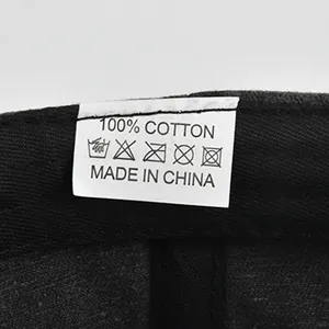 Detailed view of the wash care label for a 100% cotton vintage baseball cap