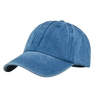 Side view of washed blue cotton baseball cap showing classic six-panel design and curved brim