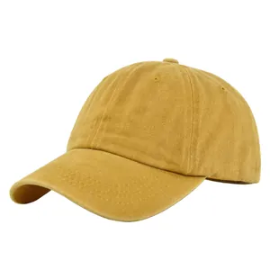 Detailed close-up of reinforced stitching on mustard yellow washed cotton baseball cap