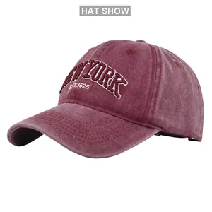 Macro shot of New York embroidery on washed burgundy vintage cotton baseball cap