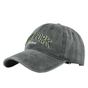 Close-up of vintage dark grey washed baseball cap with green New York 3D embroidery
