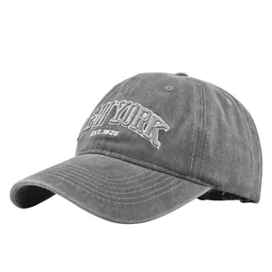 Detailed close-up of vintage washed grey baseball cap with New York embroidery