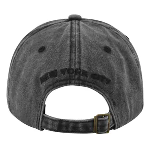 Detail view of the washed dark grey baseball cap with New York City embroidery and metal buckle