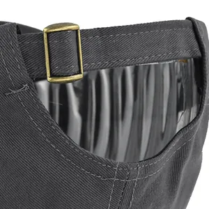 Detail of adjustable metal buckle and twill fabric on back of dark grey baseball cap