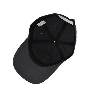 Detail view of cotton baseball cap interior with moisture wicking band and metal buckle