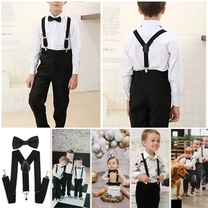 Close-up of classic black Y-back suspenders and matching bowtie set with metal clips