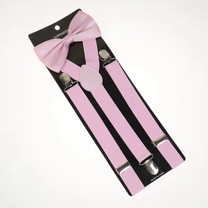 Pink bow tie and Y-back elastic suspender set with silver metal clips on card