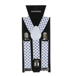 Detail of classic white and black polka dot elastic Y-shape suspenders with metal clips