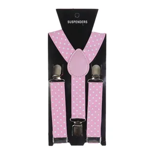 Detailed view of pink polka dot elastic suspenders with three silver metal clips on card