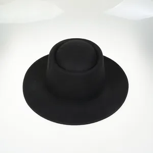 Detailed top view showing the fine wool felt texture and flat brim of this black boater hat