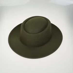 Detailed top view of a dark green wool felt flat top hat with a wide brim for winter