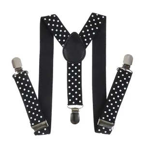 Detail of classic Y-back black polka dot suspenders with three durable metal clips