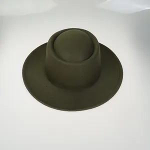 Detailed view of the dark green wool felt fedora featuring a flat brim and vintage design