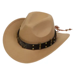 Detail of khaki wool cowboy hat featuring leather band with metal eagle and bullet accents