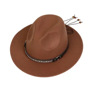 Detail of wool fedora featuring leather band with ethnic patterns and decorative beads