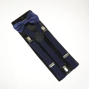 Detail of navy blue Y-back elastic suspenders and matching satin bowtie on display card
