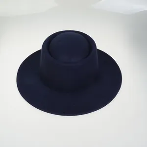 Top view of deep blue wool felt wide brim hat showing unique crown texture and shape
