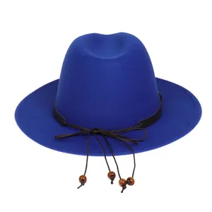 Detail of dark blue felt fedora hat featuring black band and brown string with wooden beads