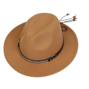 Detail of brown wool fedora with ethnic woven band, metal rings and wood bead tassels