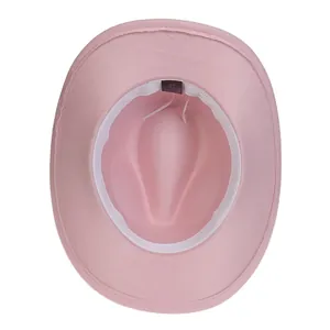 Interior detail of pink cowboy hat showing sweatband, size tag, and adjustable drawstring